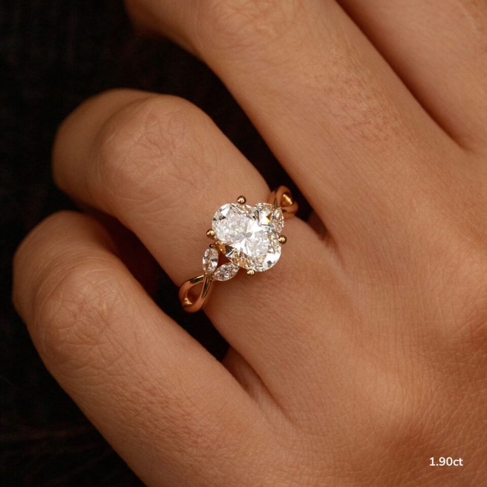 Oval Three-Stone Moissanite Ring in Yellow-Tone Rhodium-Plated Silver